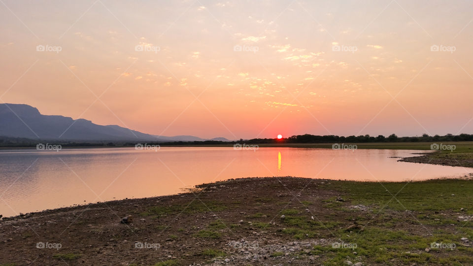 sunrise over a small lake