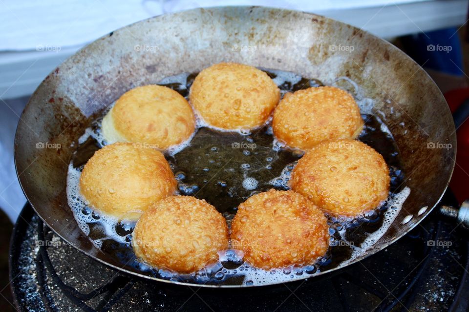 Cooking doughnuts, market.