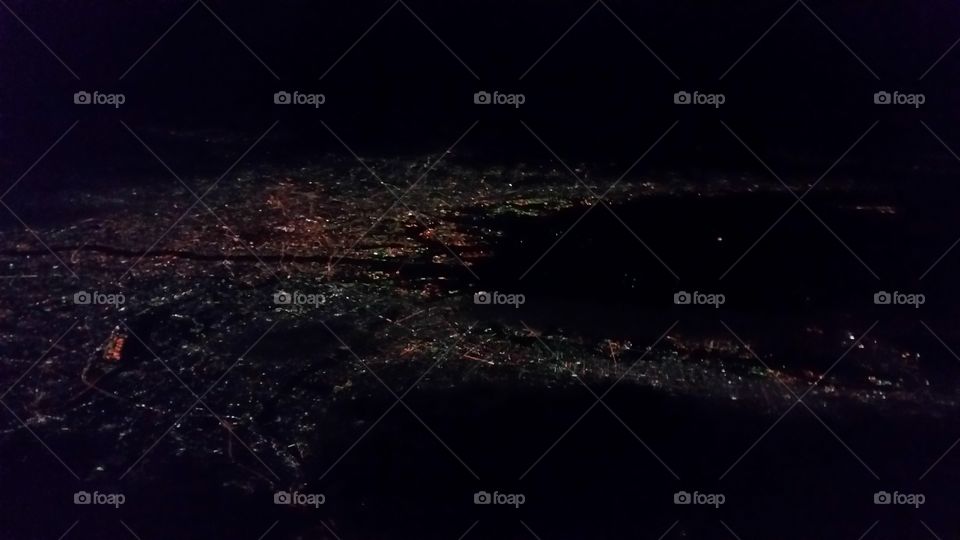 Aerial photos of a Japanese city at night from an airplane