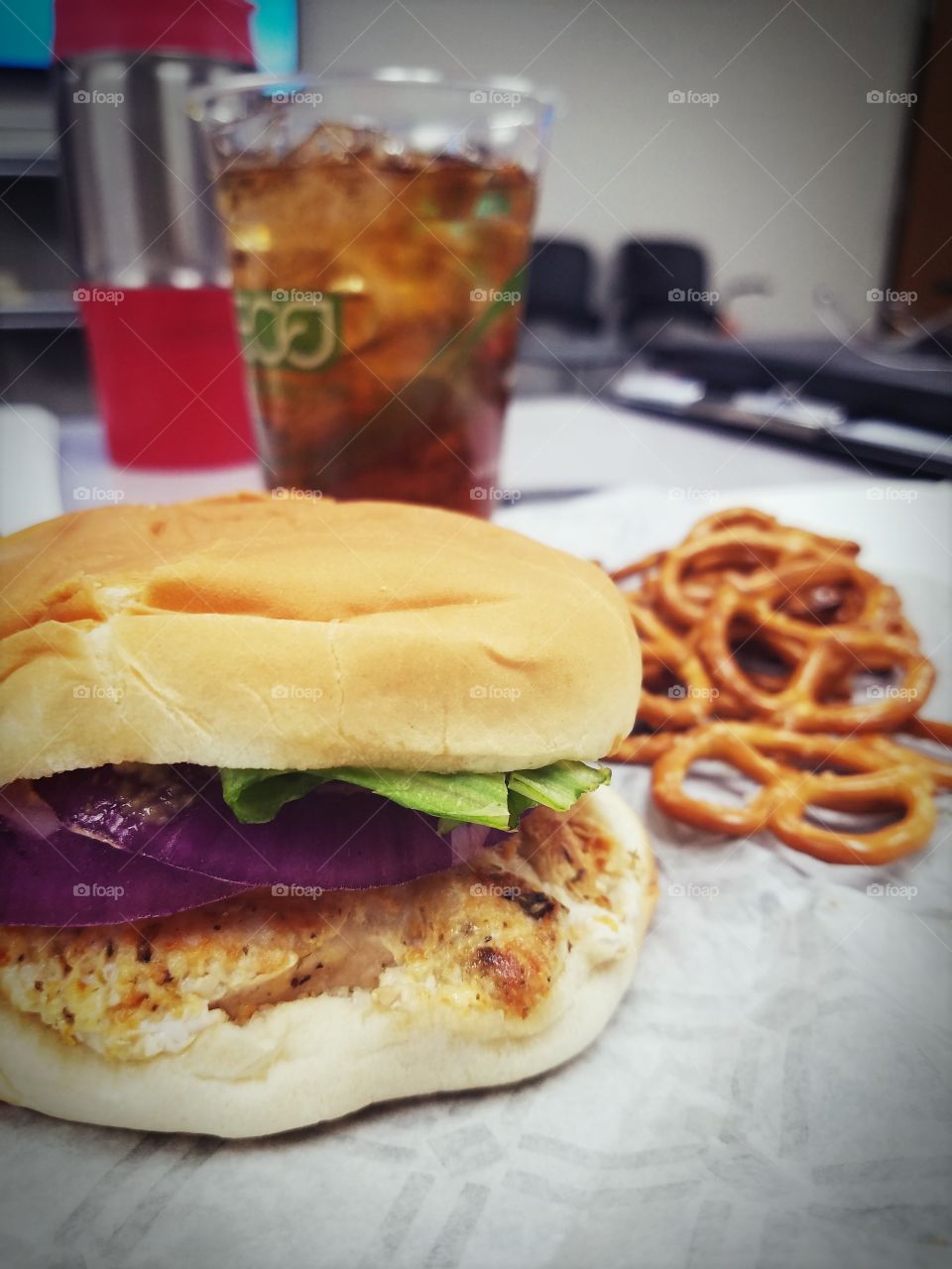 Grilled chicken sandwich and pretzels