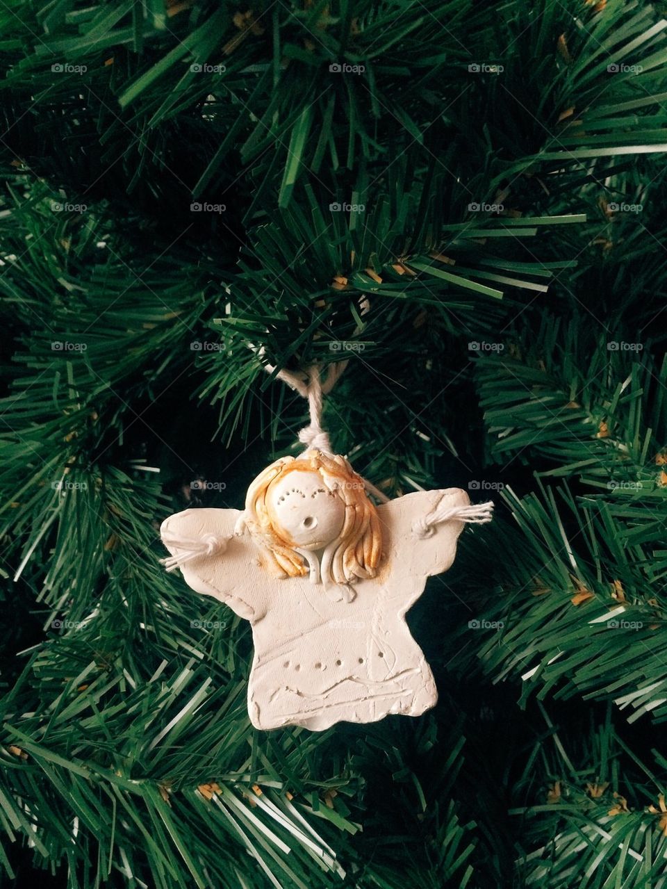 Little angel on christmas tree