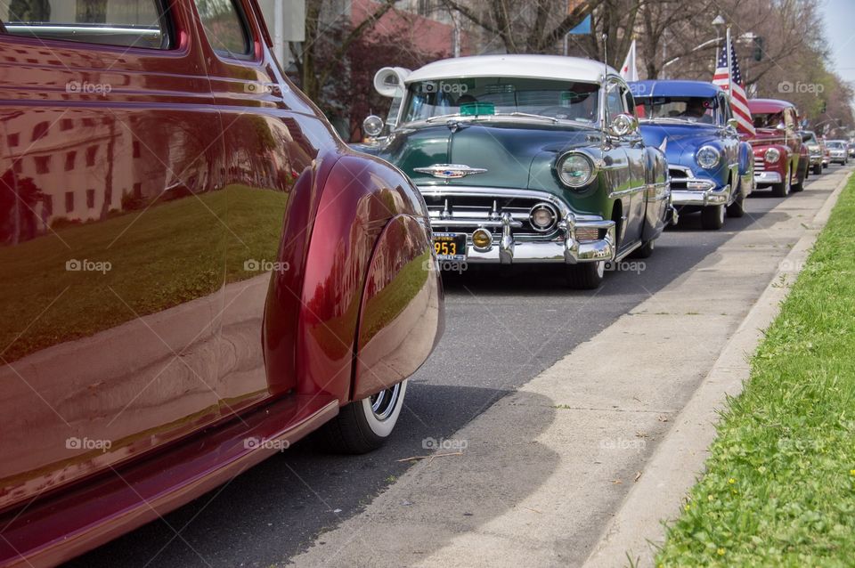 Classic cars roll along downtown Sacramento in the 2018 annual Cesar Chavez March and rally. 