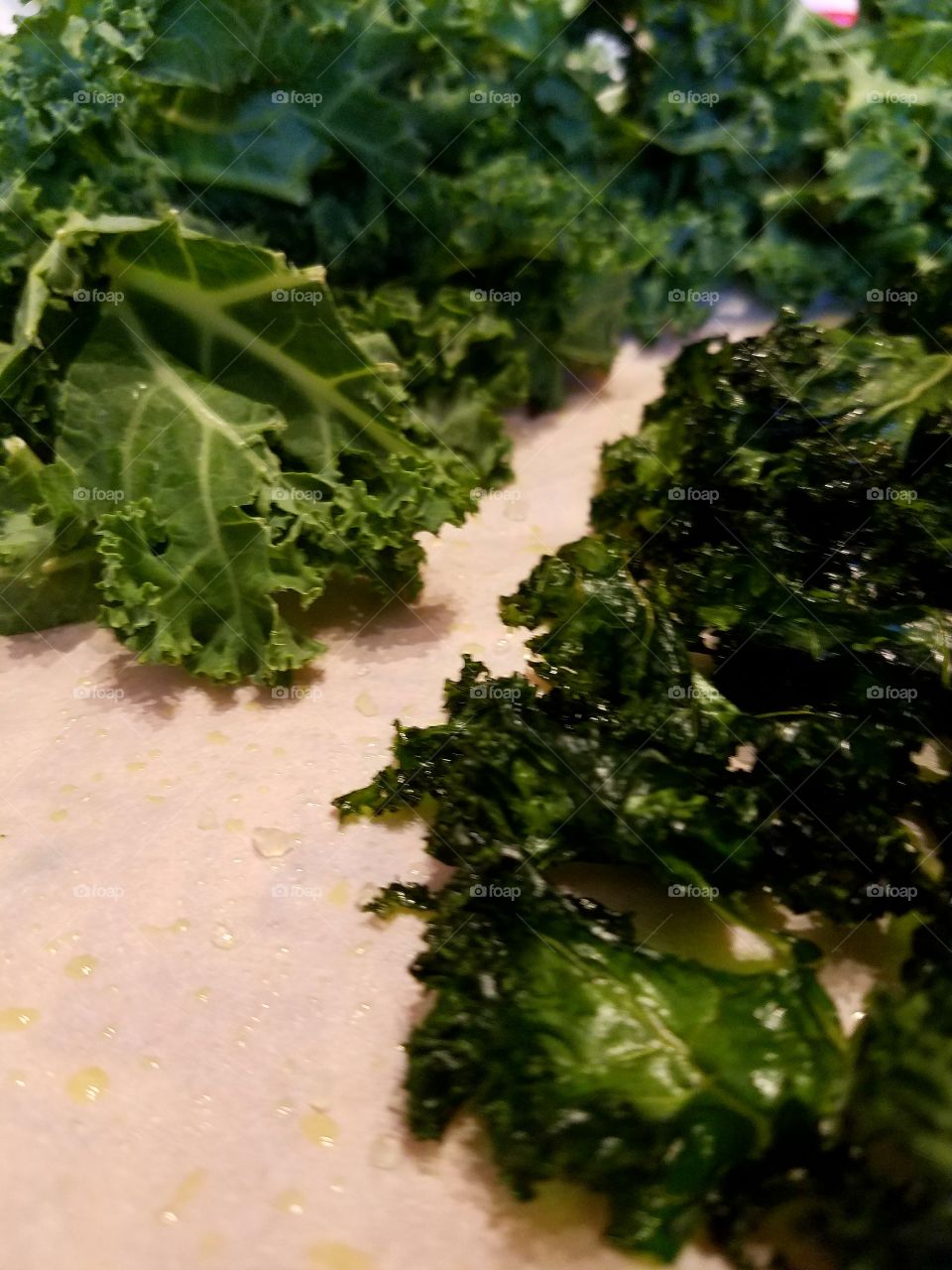 raw kale alongside baked kale crispy chips, health food.
