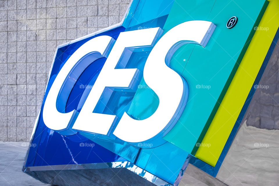 Las Vegas, NV 1-6-2023: Large logo of CES outside the entrance of LV Convention Center. Held annually, CES is the largest consumer electronics convention in the world. Vibrant cool colors on the sign.