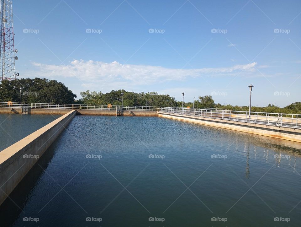 Water Treatment plant, basin, beautiful flowing water, hot summer day, good flow