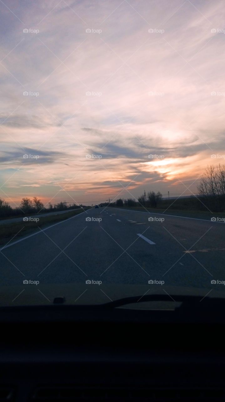 beautiful sunset and long road