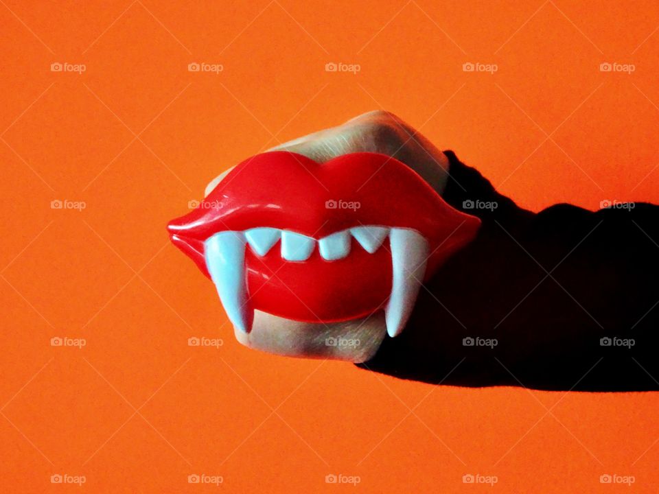 Happy Halloween vampire fangs!! Minimalist, copy space, bright colors, bold. 