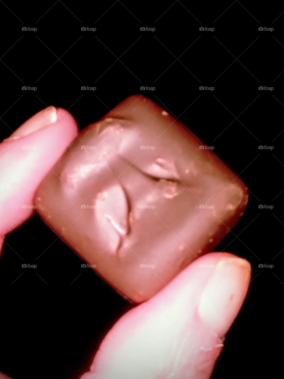 Close-up Holding Chocolate