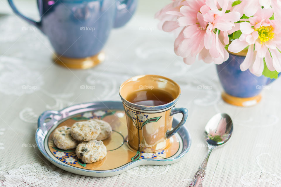 Cookies and tea cup on tray