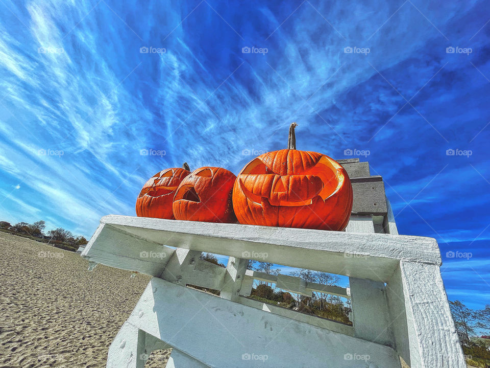 Jack O’lanterns at the lifeguard station at the beach 