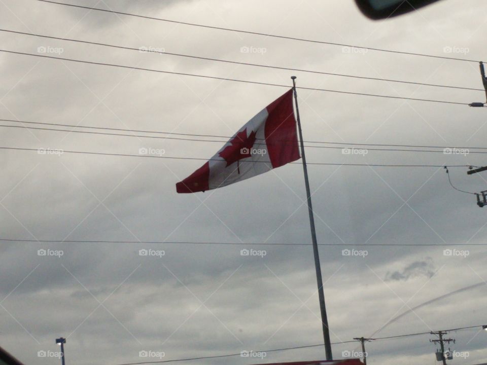 large Canadian flag blowing in the wind