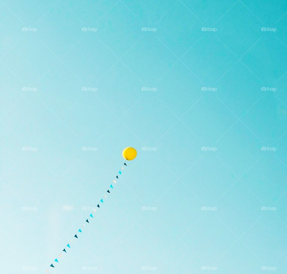 Balloon flying in the sky.