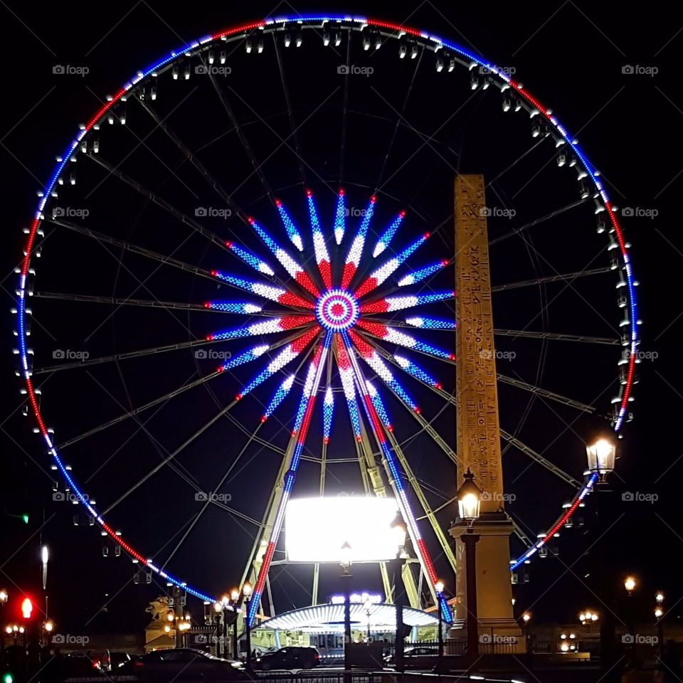The Grande  Roue on the axis of the Champs Elysées and the Jardin des Tuileries in Paris at night. Captured on a family trip.