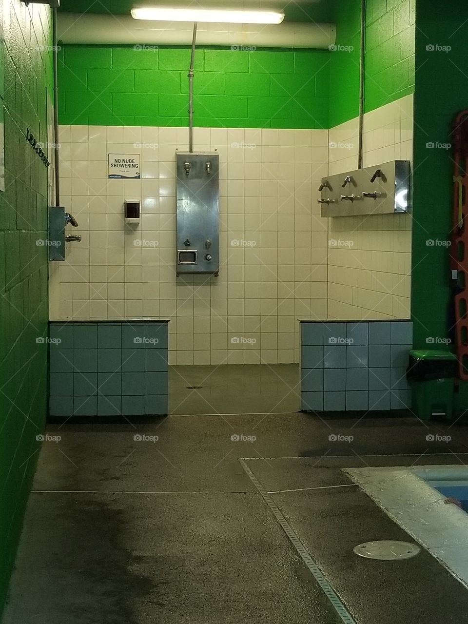 swimming pool shower with no nude showering notice