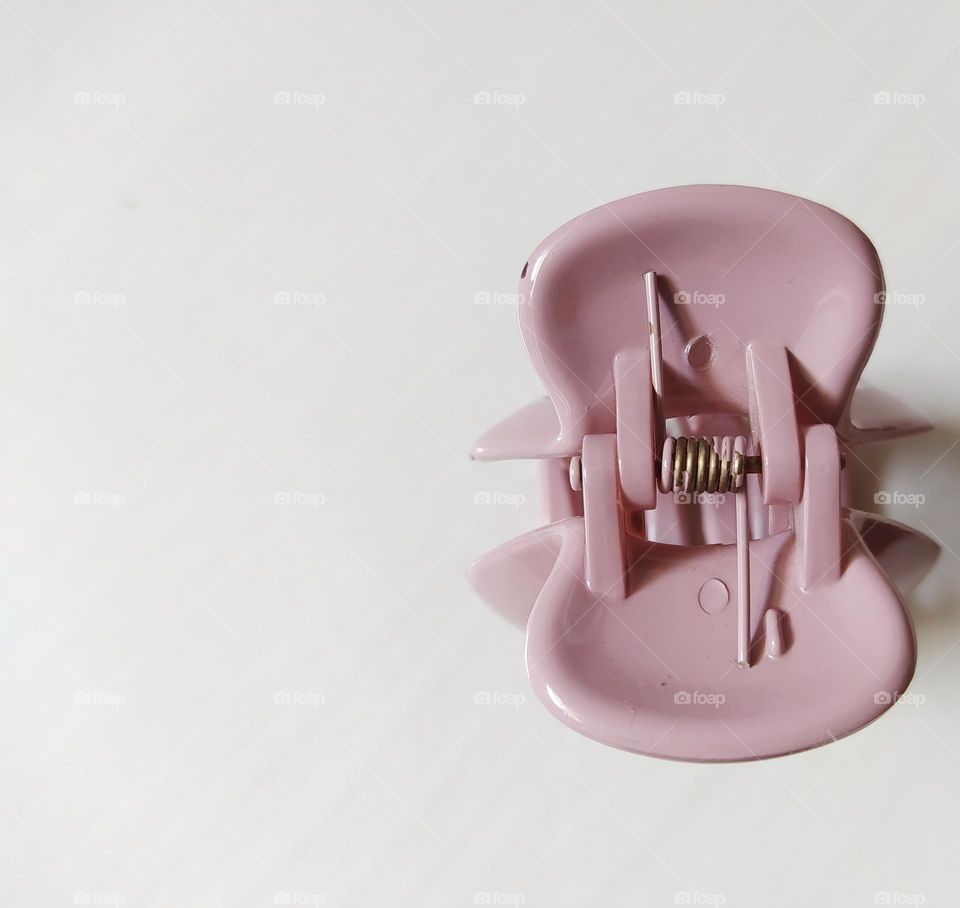 Pastel purple hair clip on a white background