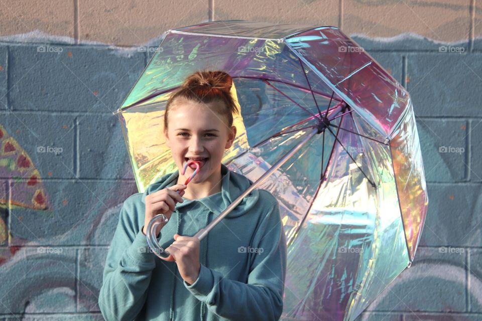 Girl holding Iridescent umbrella