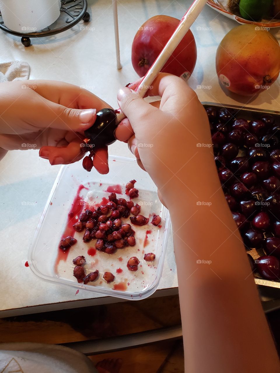 pitting cherries using a straw