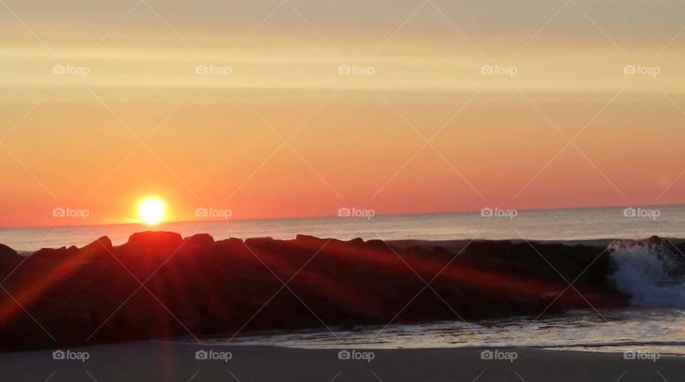 sunrise over the jetty on Pawleys Island SC