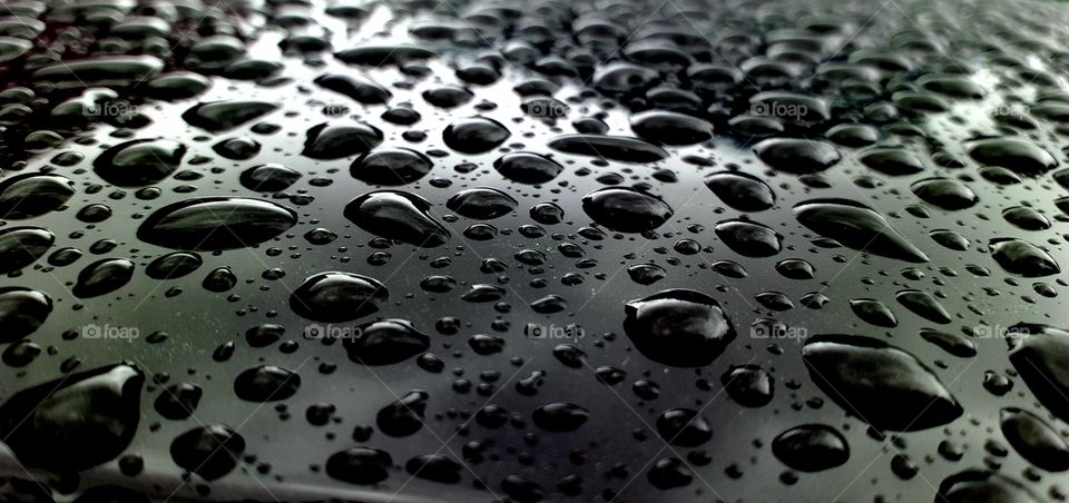 drops of water on a car.