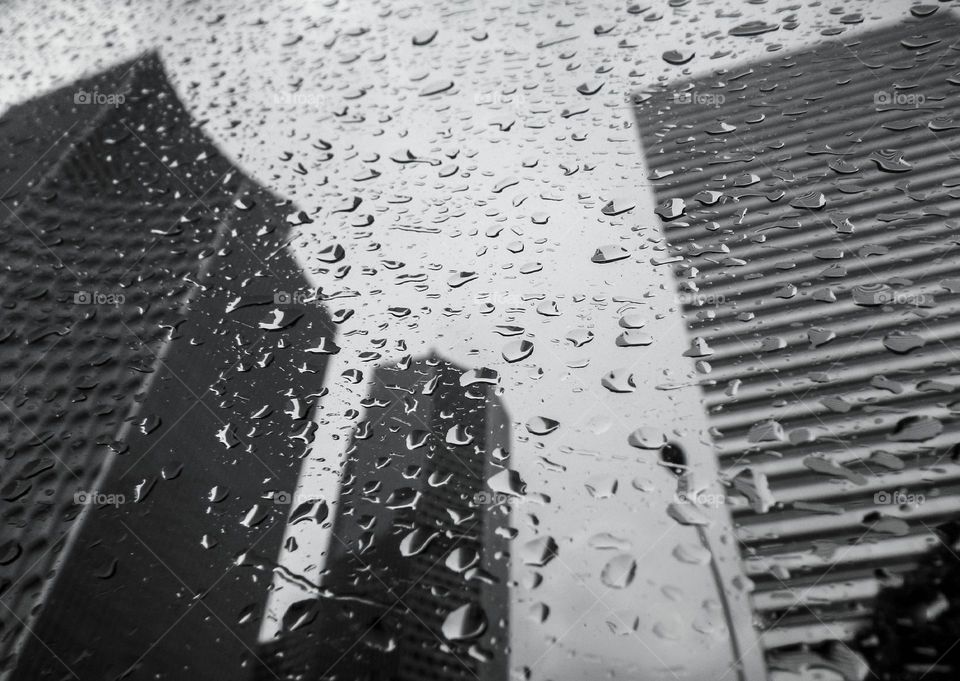 Raindrops and reflection of city buildings