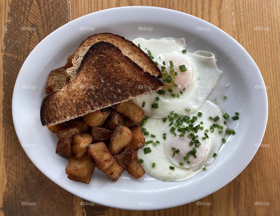 Breakfast - eggs over easy, home fires and toast with a sprinkling of chives.