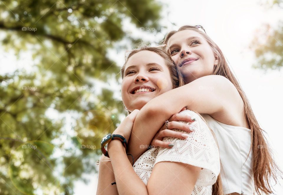 sisters embracing each other