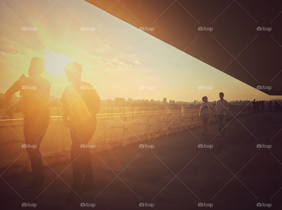 People walking in sunset lights