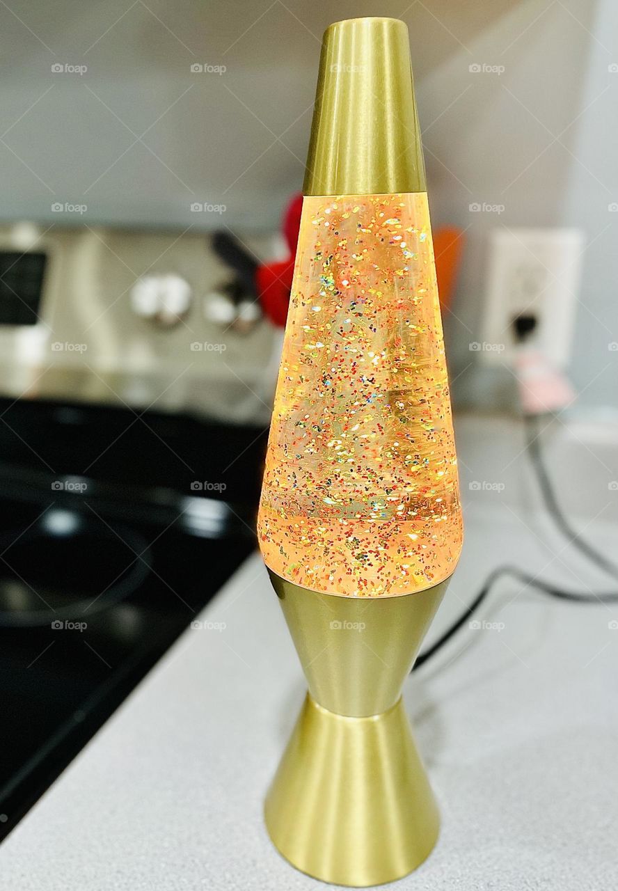 Bright sparkly lava lamp, glittering glow lava lamp, rainbow sparkles lava lamp, color explosion in a lamp