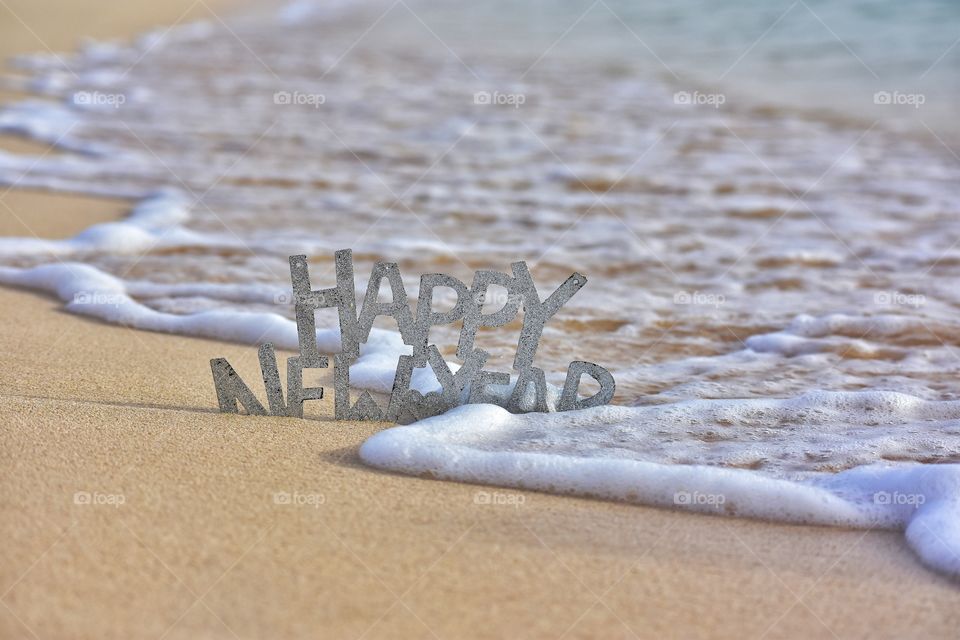 happy New year sign on the beach on fuerteventura canary island in Spain