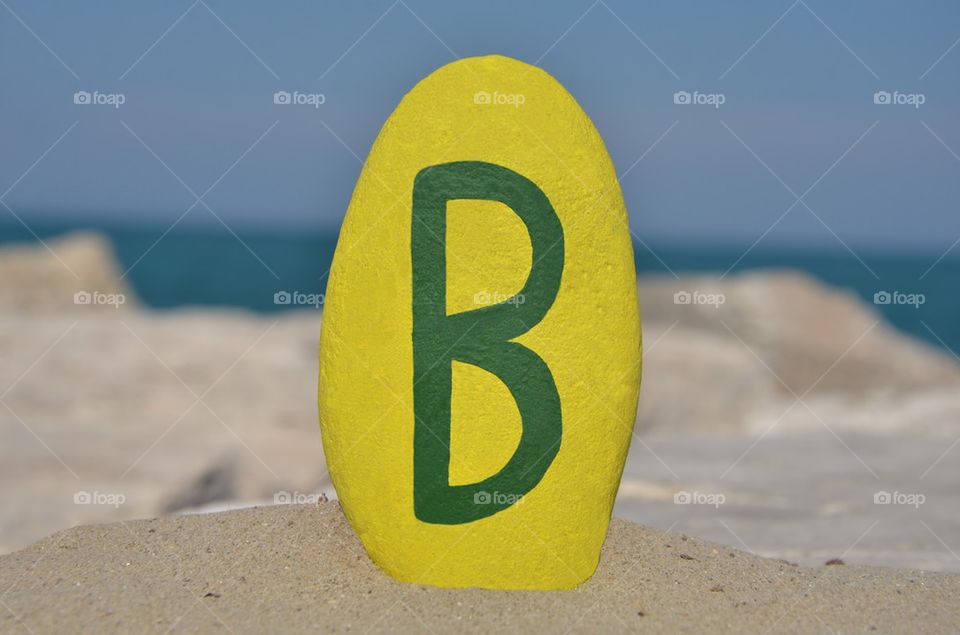 B, second letter of the alphabet on a stone