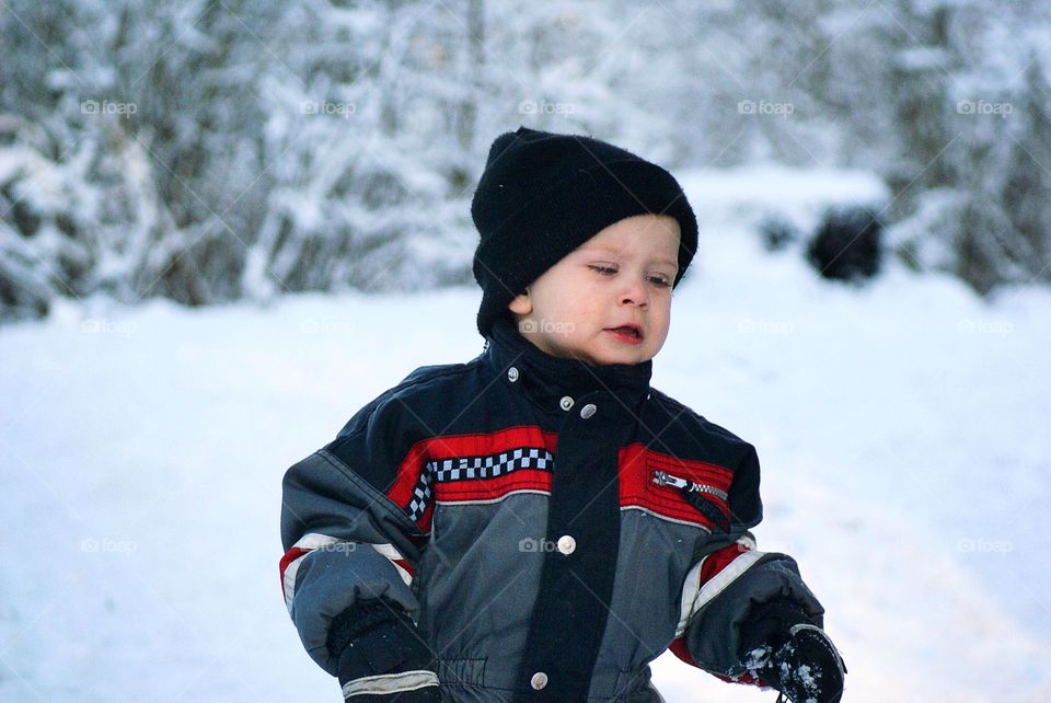 Toddler outdoors playing 