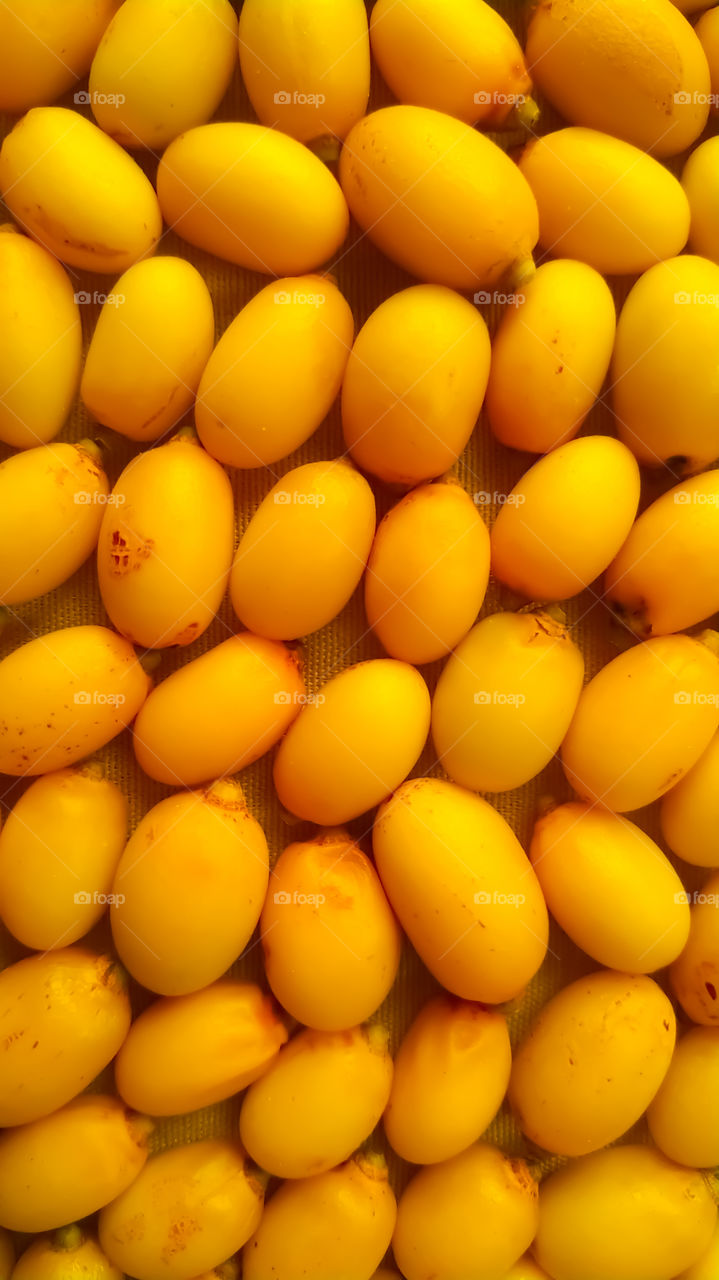 Full Frame Shot Of yellow beautiful neem fruits