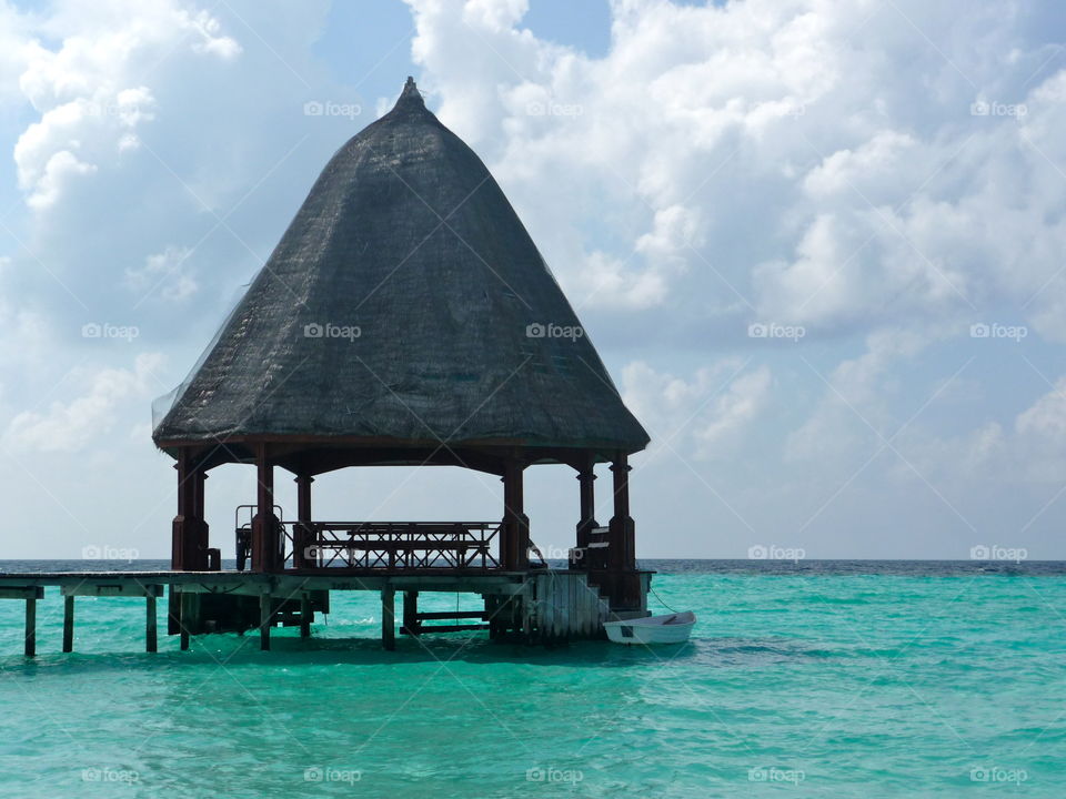 Turquoise sea and hut on The Maldives 