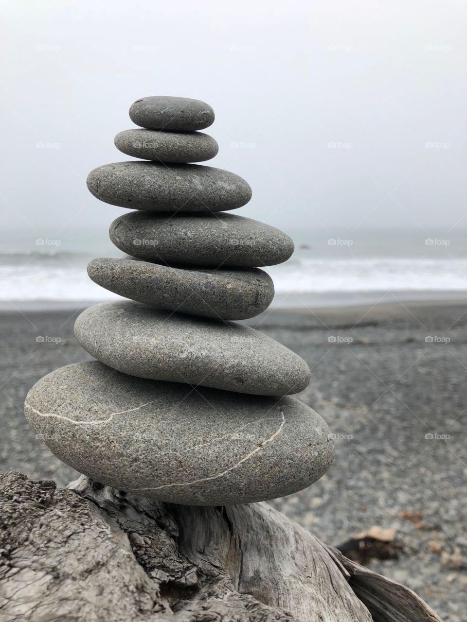 Rocks stacked on top of each other by the other man