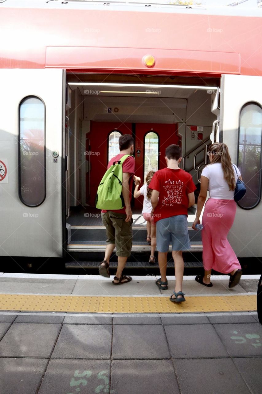 Passenger getting into the train