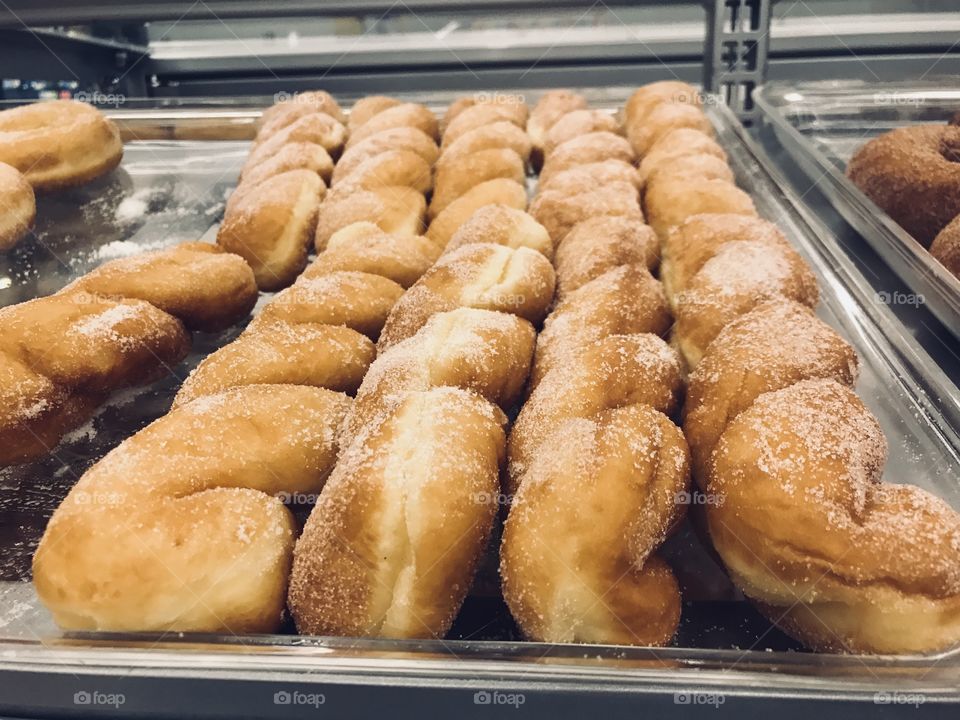 A delicious Golden cinnamon twist sugar donut on display