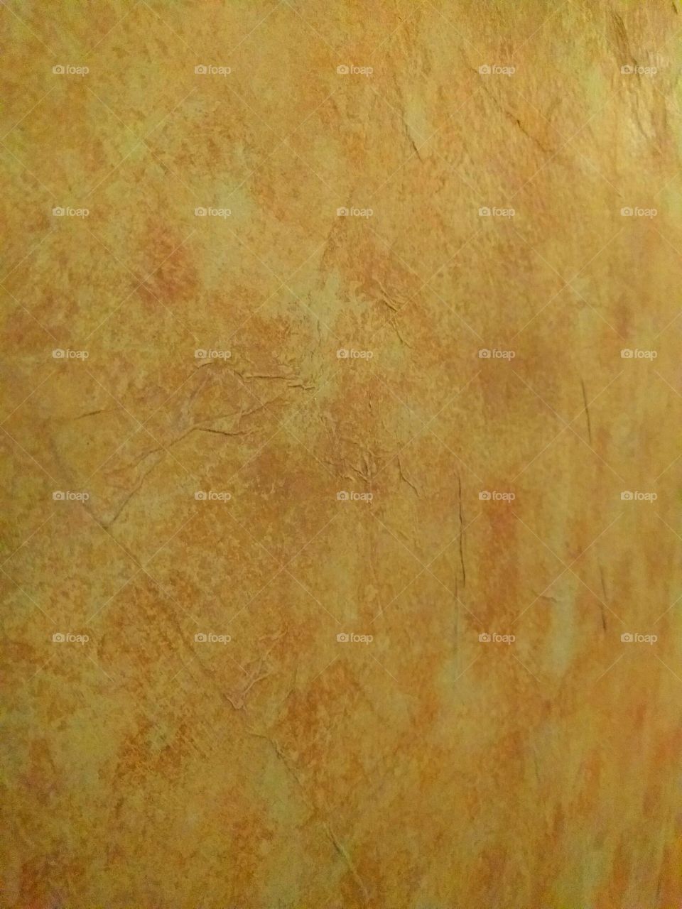 Brown Paper Wall with Rust Colored Paint Sponged onto It