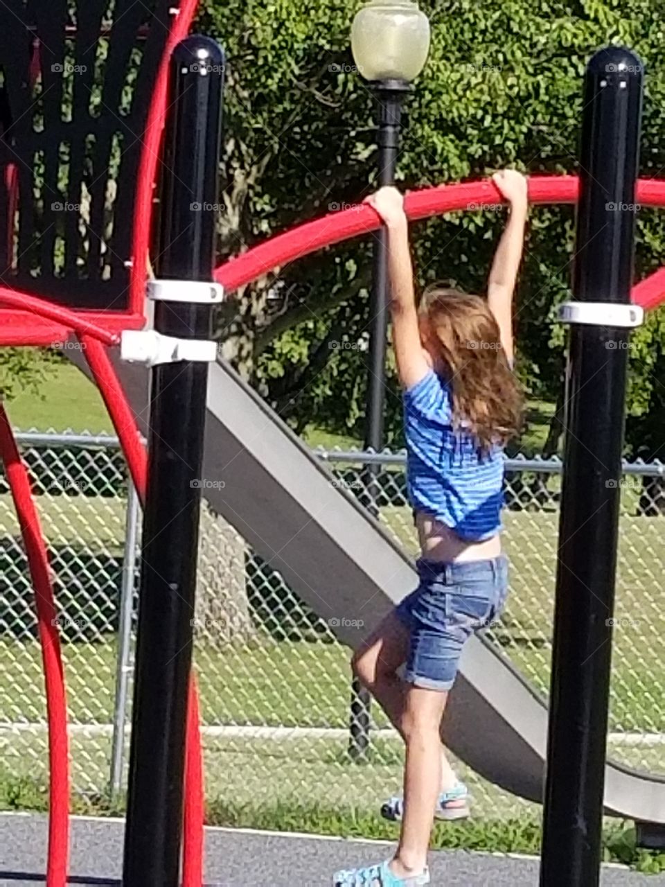 child on play equipment