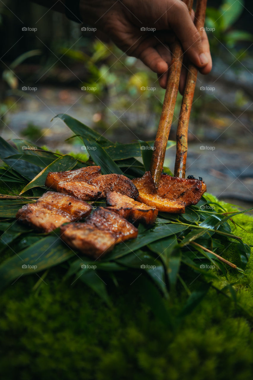 fried pork slices on leaves
