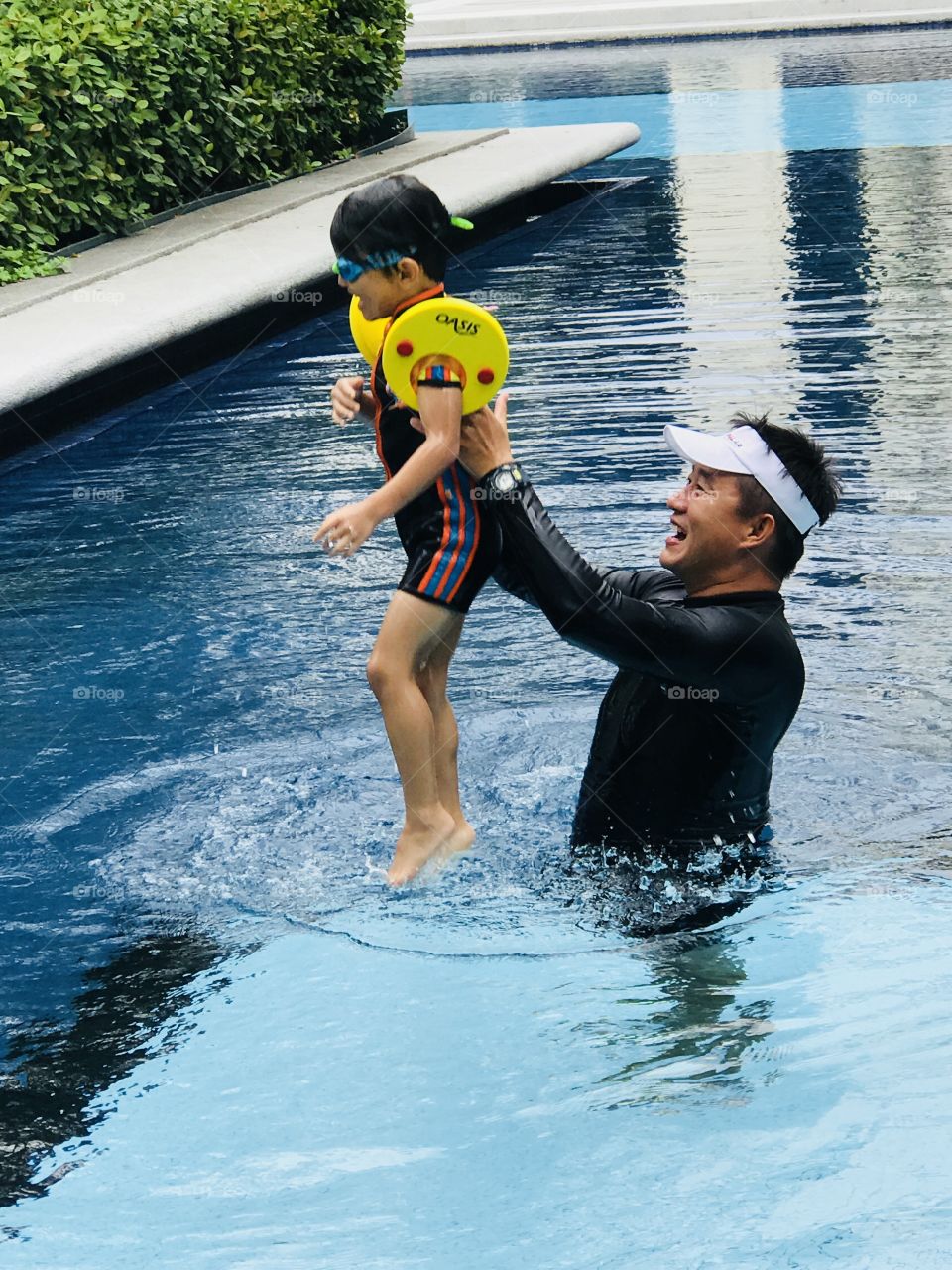 Father and Son playing at Swimming pool