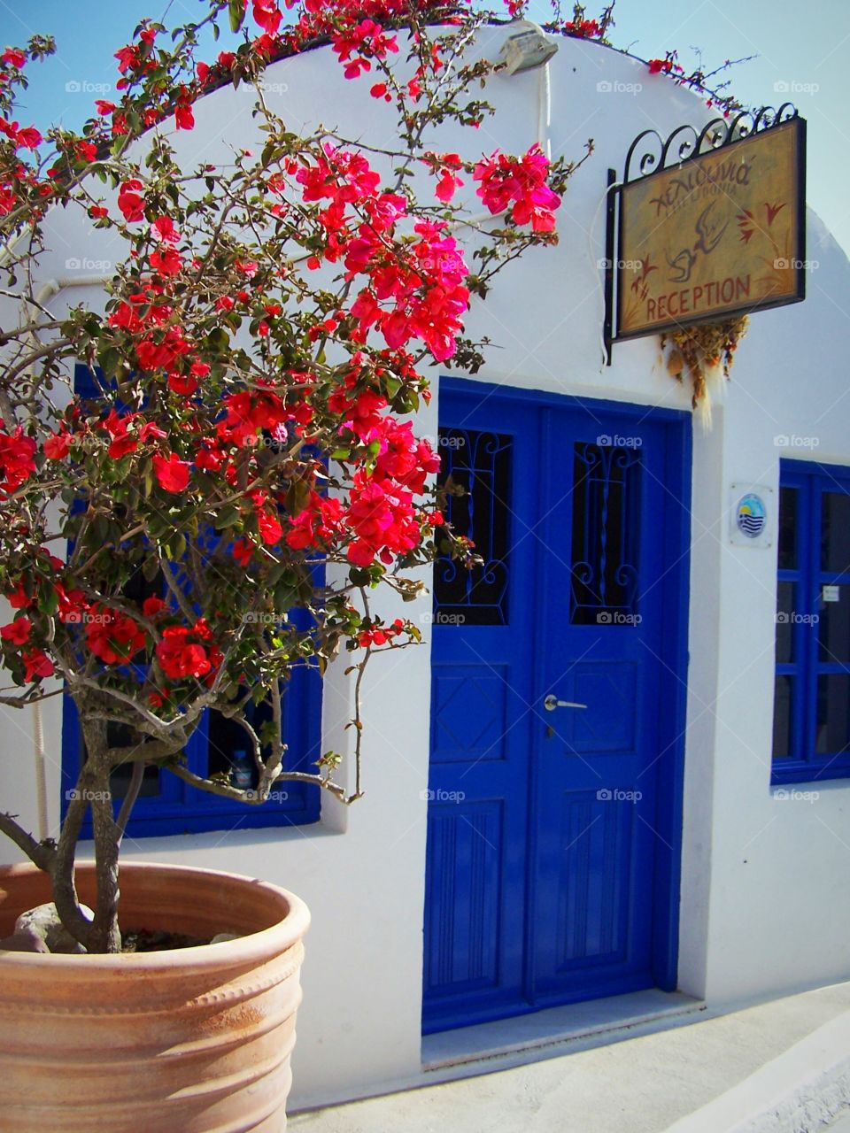 Blue door hotel Entrance on the isle of Santorini in the village of Oia in Greece