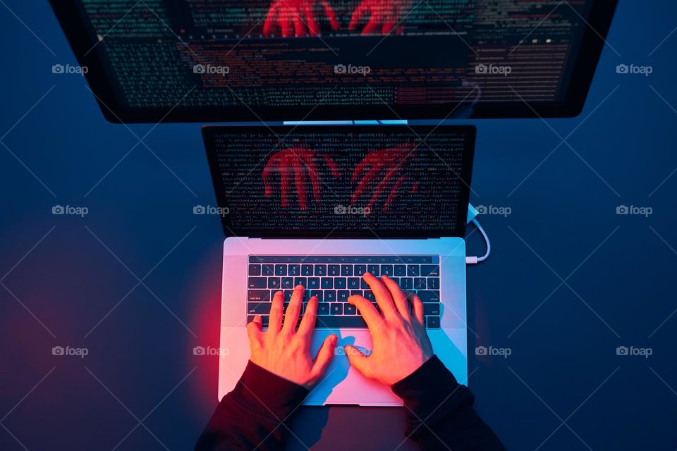 Man using computer and programming to break code. Cyber security threat. Internet and network security. Stealing private information. Person using technology to steal password and private data. Cyber attack crime