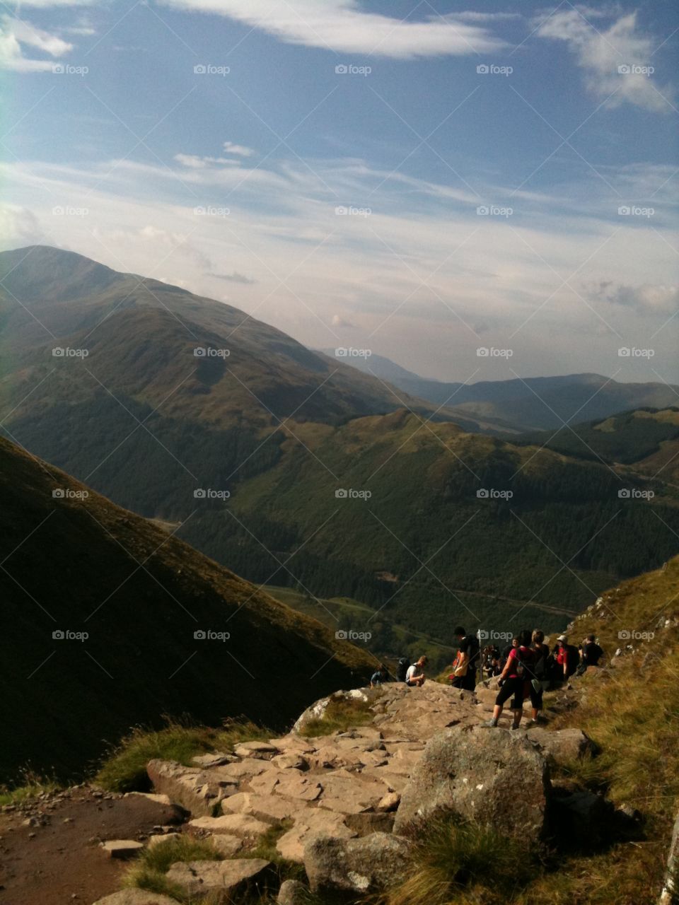 Early morning climbing Ben Nevis - clear skies but a super windy day. Lots of fellow walkers out. 
