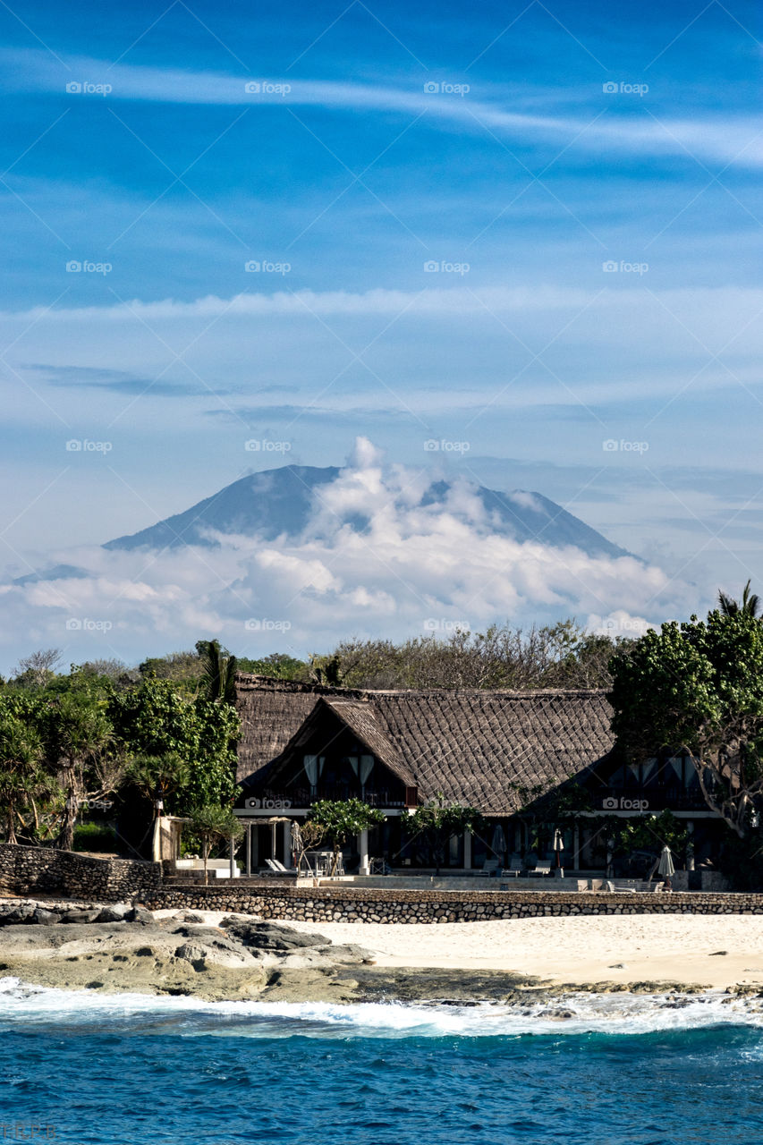 the shoreline of Nusa Lembongan with the volcano of Bali in the background
