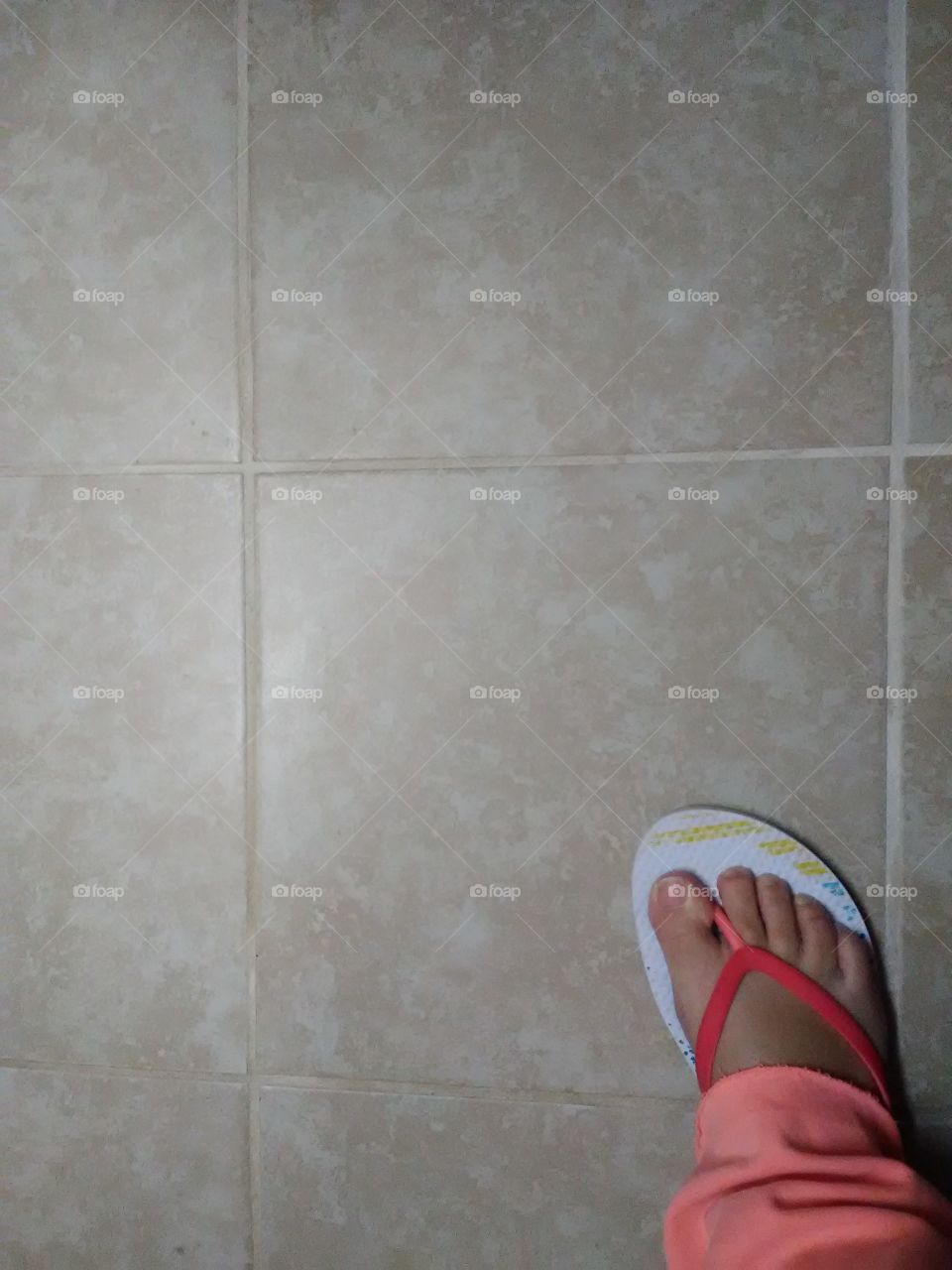 Tile floor with foot