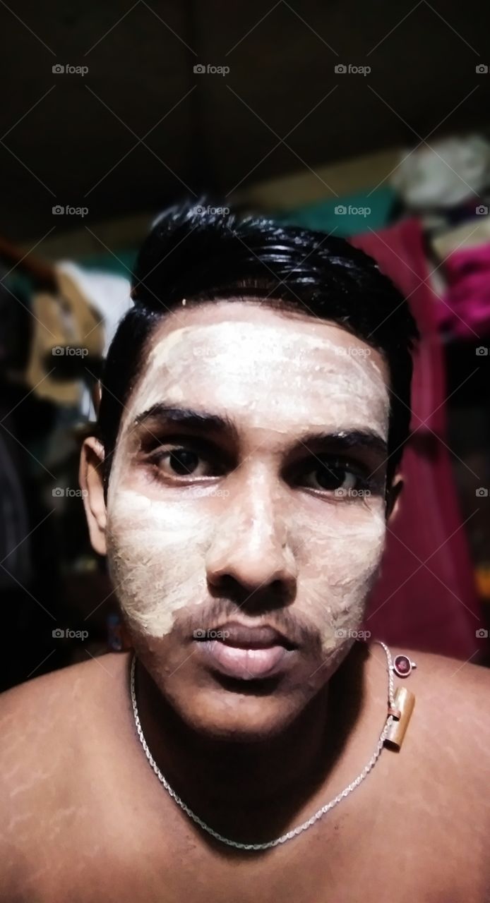 A Boy Use Face Pack In His Face.