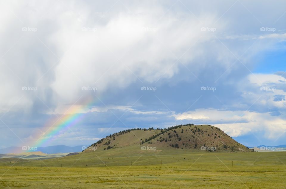 Rainbow over the hill