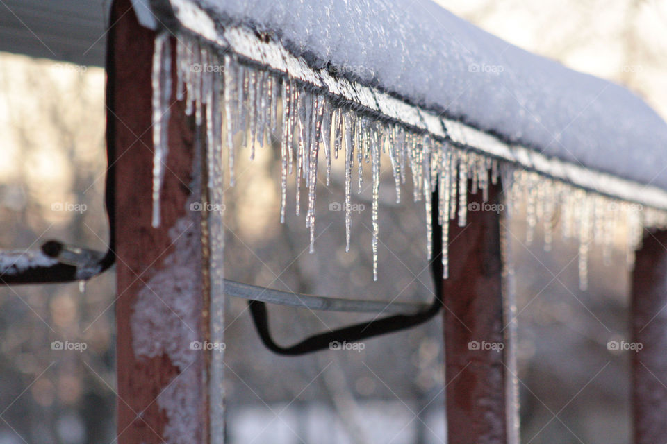 Frozen icicle white snow on barn