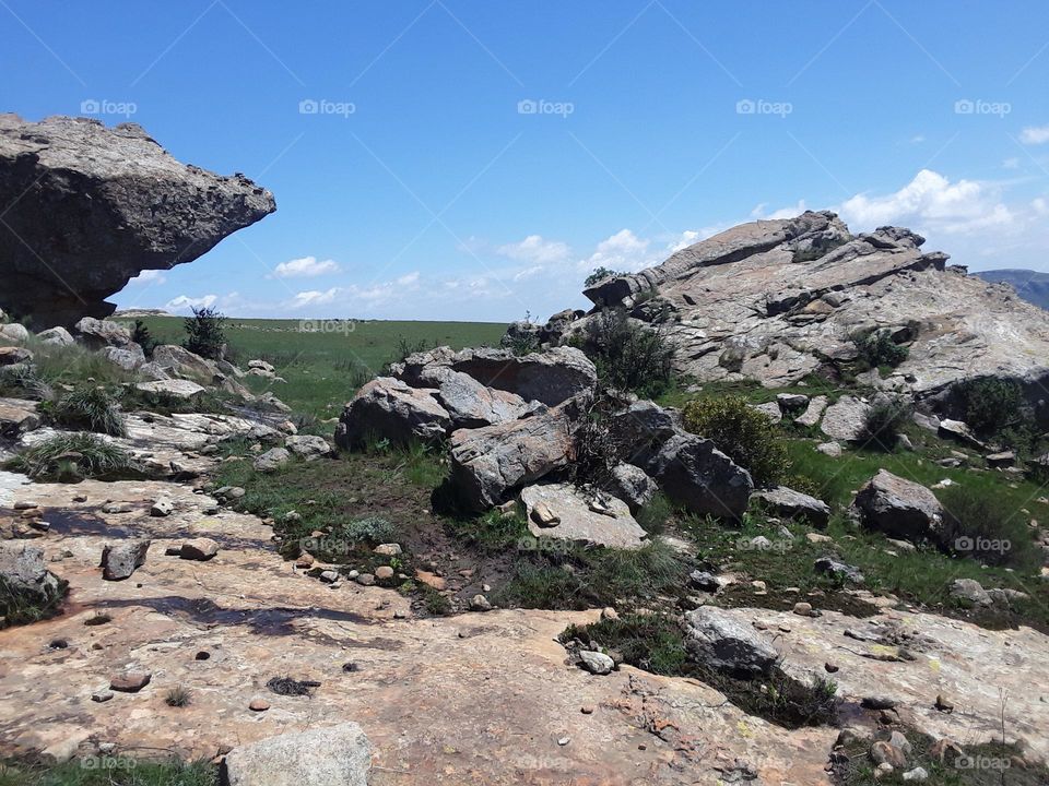 A beautiful display of of rocks and caves at the mountain view.