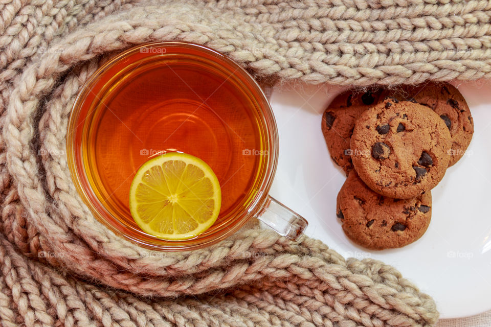 Cup of tea with lemon and cookies